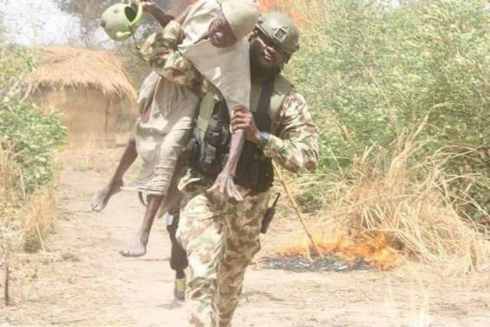 Old man rescued by soldier during a shootout between troops and Boko Haram terrorists in Gobara, Gwoza local government area of Borno state