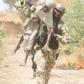 Old man rescued by soldier during a shootout between troops and Boko Haram terrorists in Gobara, Gwoza local government area of Borno state