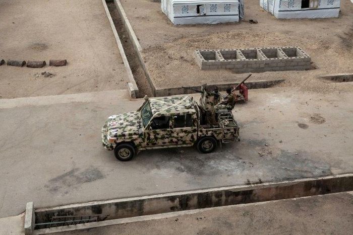 A Nigerian army vehicle patrols in the town of Banki in northeastern Nigeria in April last year. Troops say they have battled Boko Haram for years without relief.