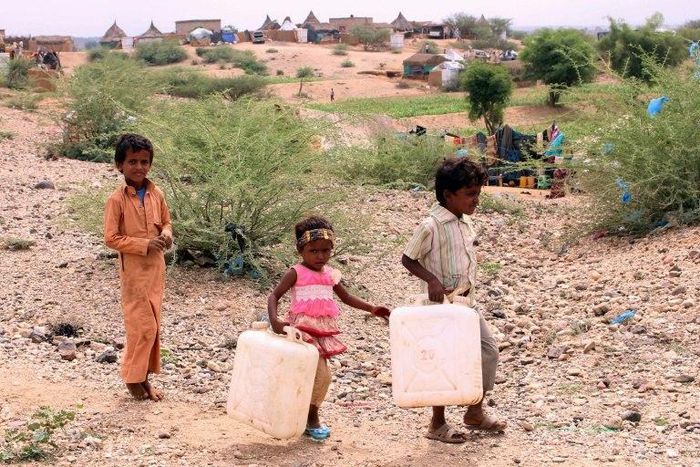 Yemeni kids collecting water on October 22, 2018. Now widespread famine looms, per UN