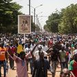 People gather during a rally in the Burkinabe capital Ouagadougou in the first large protest by opposition supporters against the current government's policy since the election of President Kabore in November 2015