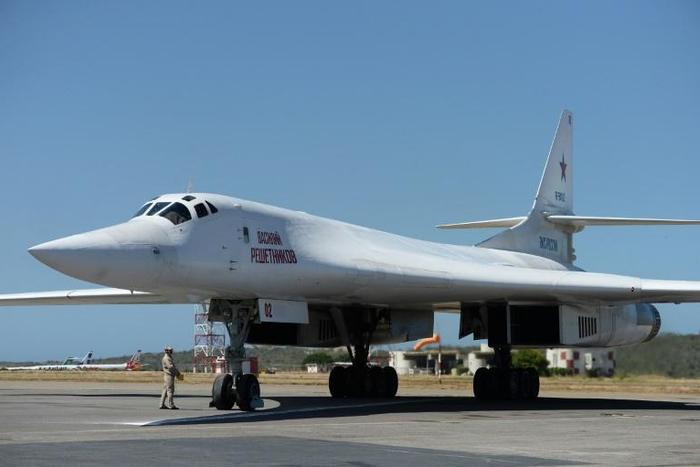 A Russian Tupolev Tu-160 strategic supersonic bomber is pictured after landing at Maiquetia International Airport, Caracas, on December 10, 2018. Venezuela's Defence Minister Vladimir Padrino announced that Venezuela and Russia are to hold joint milita...