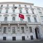 A flag flutters at the Turkish embassy in Vienna, Austria, where a row over dual nationality has become a major talking point among people of Turkish origin