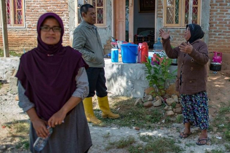 Dewi told AFP she couldn't believe she survived the tsunami wave