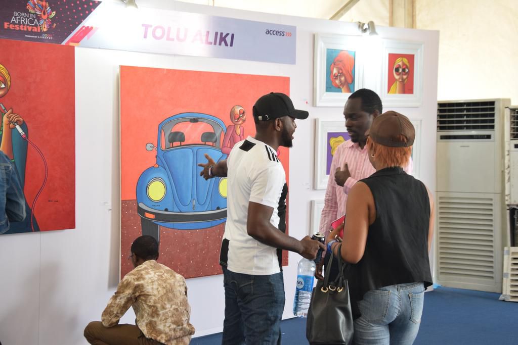 Guests admiring Tolu Aliki’s art