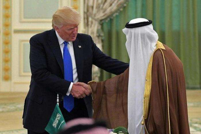 US President Donald Trump (L) shakes hands with Saudi Arabia's King Salman bin Abdulaziz al-Saud during a signing ceremony at the Saudi Royal Court in Riyadh on May 20, 2017