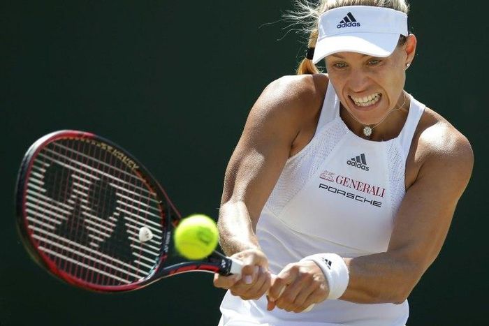 Germany's Angelique Kerber returns against Spain's Garbine Muguruza during their women's singles match during the 2017 Wimbledon Championships in Wimbledon, southwest London, on July 10, 2017