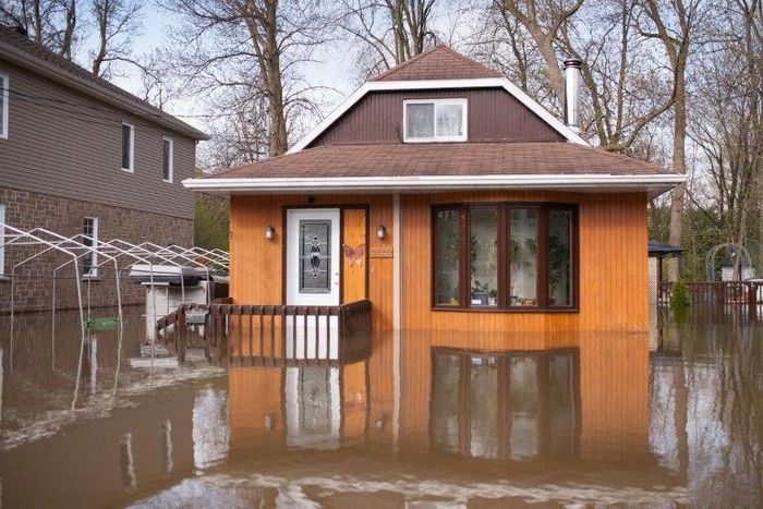 A flooded home in the Montreal borough of Pierrefonds. Floods and heavy rains have led to evacuations and caused extensive damage in waterlogged eastern Canada