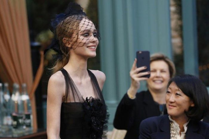French-American actress and model Lily-Rose Depp presents a creation for Chanel, during the 13th Métiers d'Art show in Paris