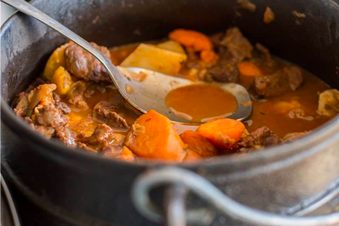 SOUTH AFRICA: Potjiekos is a one-pot dish comprising of meat and vegetables slowly cooked with a Dutch-Malay spice blend. It can be found all across South Africa, including at the Oranjezicht City Farmer's Market in Cape Town.