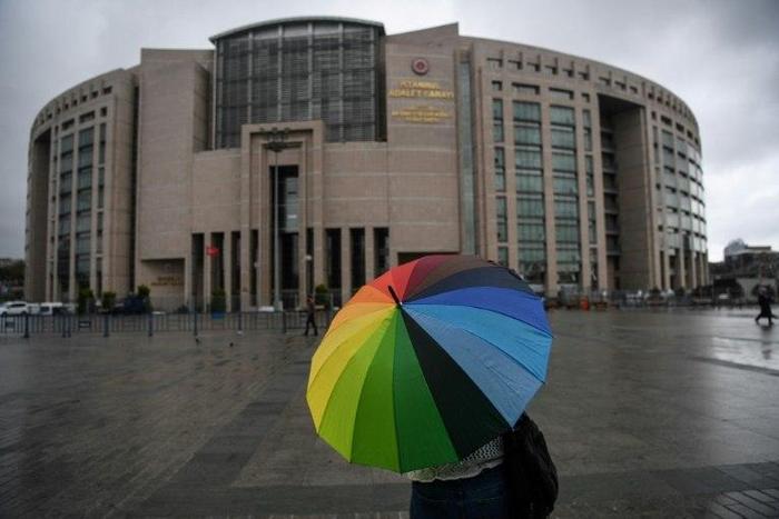 A Turkish court orders that six human rights activists including Amnesty International's Turkey director remain in custody for aiding a terror group, in a case the NGO calls a 'travesty of justice'