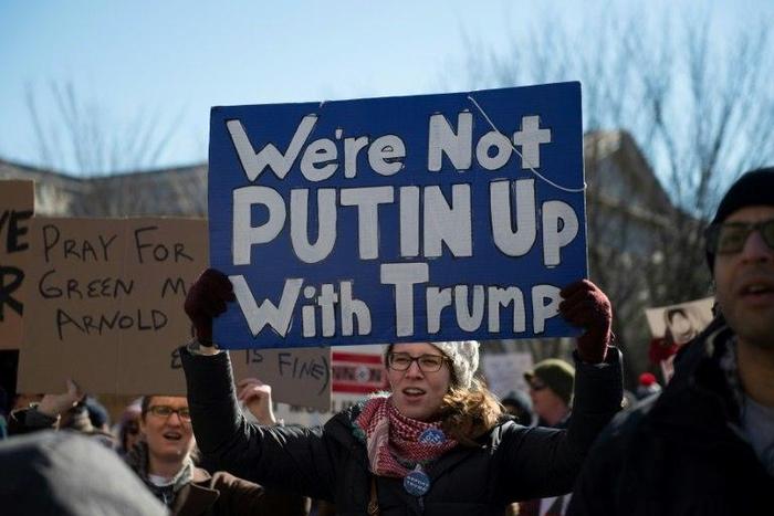 People protest outside the White House on February 4, 2017