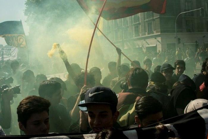 Students march to demand the government to speed up a long-awaited reform to guarantee universal access to free public education, in Santiago on April 11, 2017