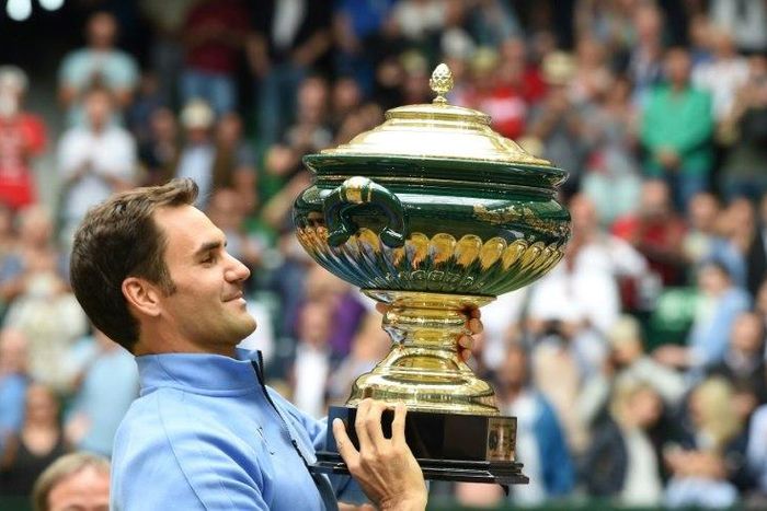 Roger Federer poses with his trophy after winning his final match against Alexander Zverev, at the Gerry Weber Open tennis tournament in Halle, western Germany, on June 25, 2017