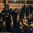 Police face demonstrators during a protest in front of the police headquarters in the 19th arrondissement of Paris on