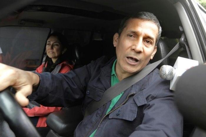 Peruvian former president Ollanta Humala as he leaves his home with his wife Nadine Heredia in Lima on July 13, 2017, after prosecutors requested their arrest on money laundering and conspiracy charges