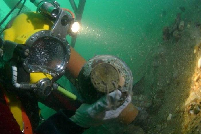 A diver works on the wreck of the Rooswijk, a Dutch East India Company ship which sank in 1740, on the sea bed off the coast of Ramsgate, southeast England, in a picture released by Historic England in London on August 18, 2017
