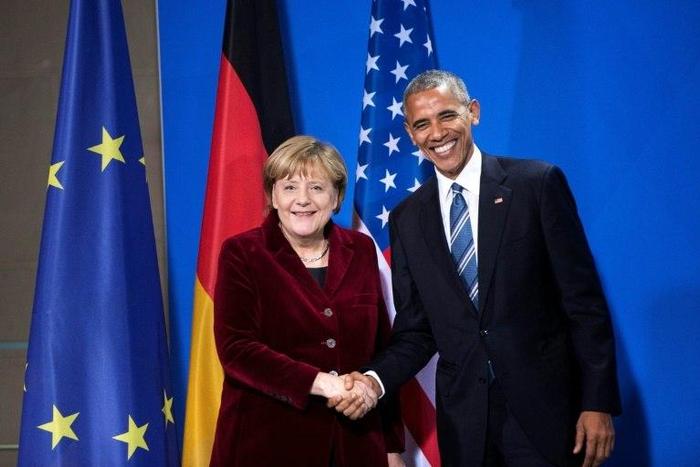 German Chancellor Angela Merkel and US President Barack Obama shake hands following a press conference at the Chancellery in Berlin in November 2016
