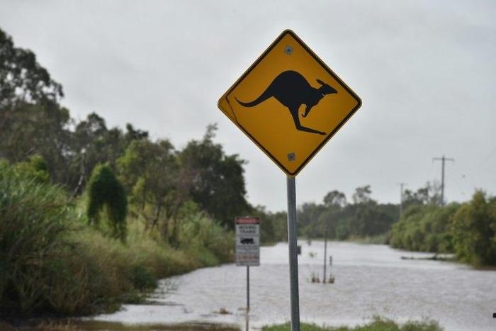 Torrential rain is hampering relief efforts after a powerful cyclone wreaked havoc in northeast Australia, with floods sparking emergency rescues as fed-up tourists wait to be evacuated from resort islands