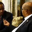 Kenyan President Uhuru Kenyatta (L) speaks with his Sudanese counterpart Omar al-Bashir during their meeting in Khartoum on October 29, 2016