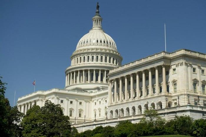 Lawmakers increase military spending in a deal to fund the US government through September