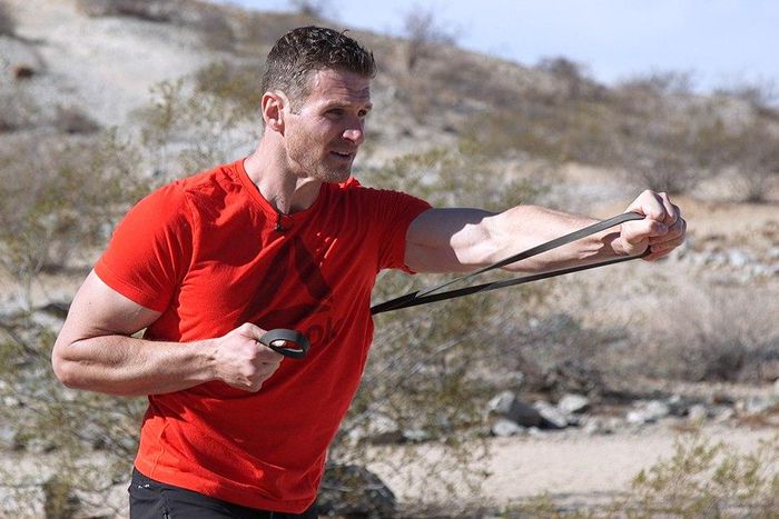 Standing single arm band press.