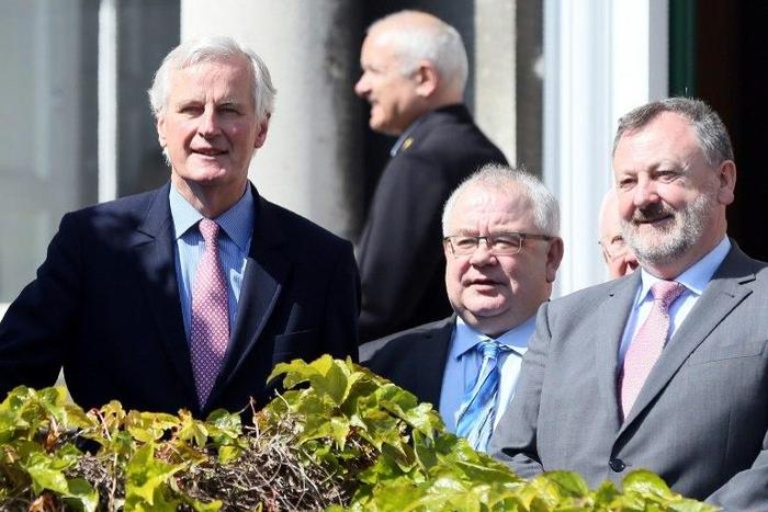 EU Brexit negotiator Michel Barnier (left) pledged in an address to Irish lawmakers to work with Dublic to avoid a 'hard border' with Northern Ireland when Britain leaves the EU