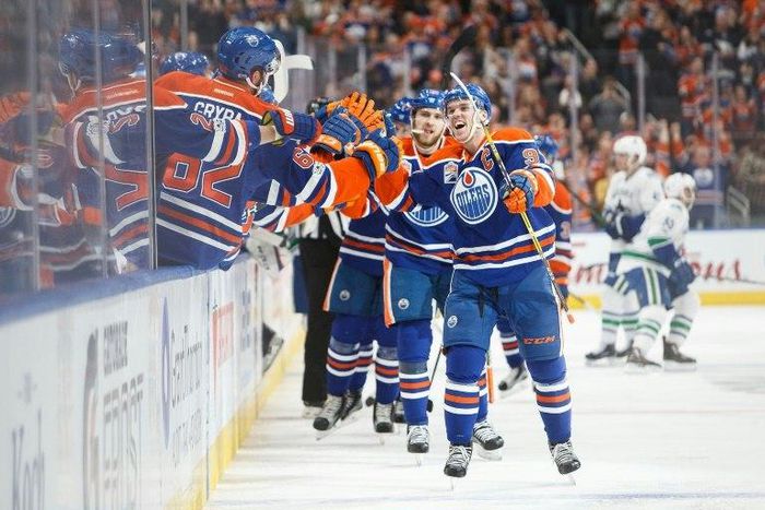 Connor McDavid of the Edmonton Oilers celebrates his 100th point on an assist against the Vancouver Canucks, at Rogers Place in Edmonton, Alberta, on April 9, 2017