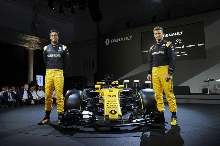Renault Sport Formula One drivers Jolyon Palmer (L) and Nico Hulkenberg pose for photographers as Renault launch the R.S.17, their new car for the 2017, during a launch event at the Royal Horticultural Halls in London February 21, 2017