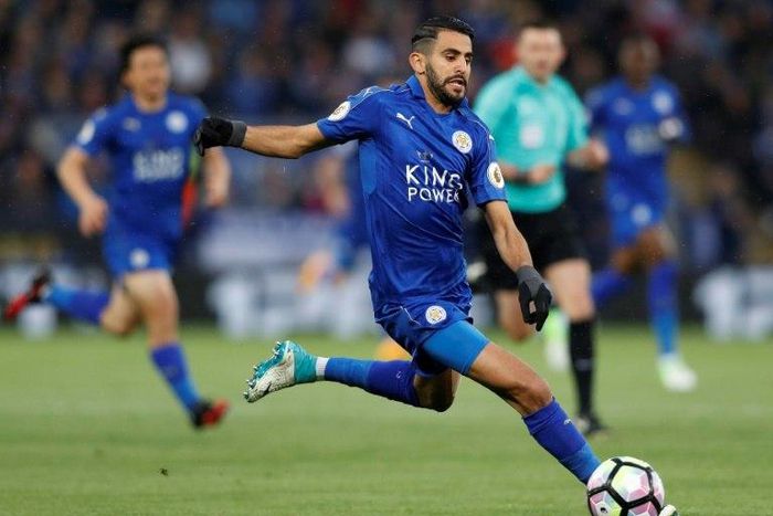 Leicester City's midfielder Riyad Mahrez runs with the ball during the English Premier League football match between Leicester City and Tottenham Hotspur at King Power Stadium in Leicester, central England on May 18, 2017