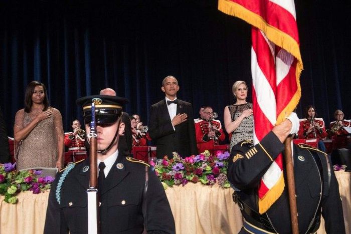 US President Barack Obama (C), First Lady Michelle Obama (L), and White House Correpondents' Association president Carol Lee (R) attend the 102nd White House Correspondents' Association Dinner in Washington, DC, in 2016