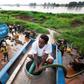 Truck drivers collect water directly from the Nile river to distribute to residents in Juba, South Sudan