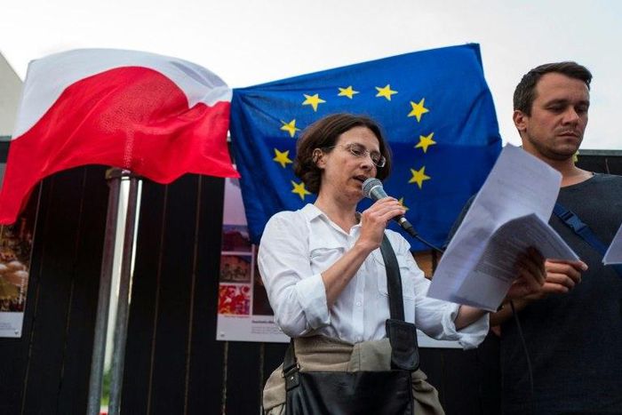 Protestors criticized a controversial reform of the Supreme Court Polish lawmakers adopted in July despite the threat of unprecedented EU sanctions