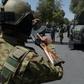 Afghan security arrive at the site of a suicide blast last month: intelligence officials say they have found a huge cache of explosives in Kabul
