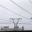 Electricity pylons carry power from Cape Town's Koeberg nuclear power plant August 13, 2015. REUTERS/Mike Hutchings/File Photo