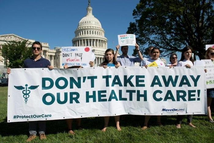 US protesters demonstrate against the Republicans' healthcare bill as they stage a rally outside the US Capitol in Washington, DC