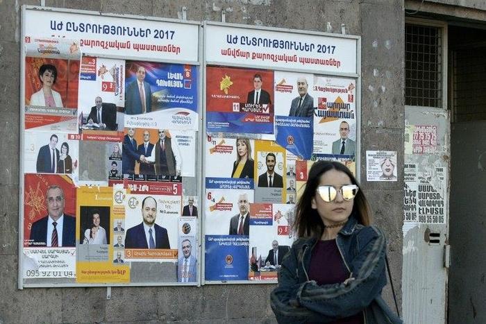 Election posters in Yerevan, where Armenians are voting in landmark legislative polls for the first time since the adoption of constitutional reforms aimed at transforming the ex-Soviet country into a parliamentary republic