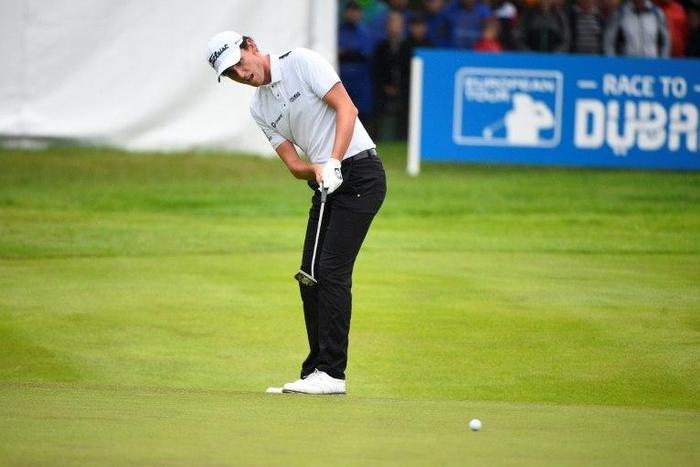 Italy's Renato Paratore putts on green 18 on June 4, 2017