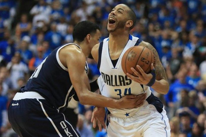 Devin Harris of the Dallas Mavericks is fouled by Andre Roberson of the Oklahoma City Thunder during game four of the Western Conference Quarterfinals of the 2016 NBA Playoffs at American Airlines Center on April 23, 2016 in Dallas, Texas