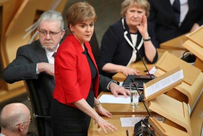 Scotland's lawmakers are due to back First Minister Nicola Sturgeon's (C) call for a second independence referendum when they vote in Edinburgh