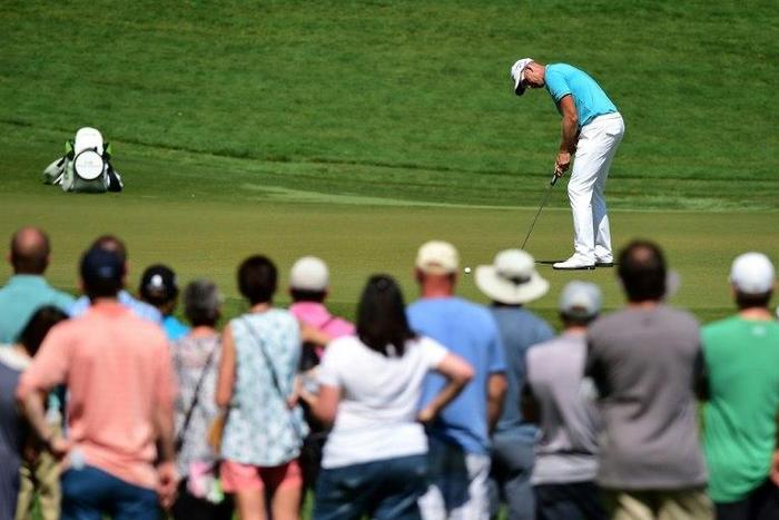 Henrik Stenson of Sweden attempts a putt on the eighth green during the third round of the Wyndham Championship, at Sedgefield Country Club in Greensboro, North Carolina, on August 19, 2017