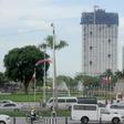 The 49-storey Torre de Manila high-rise condominium looms in the background from the Jose Rizal tomb and monument at Luneta Park in Manila