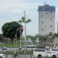 The 49-storey Torre de Manila high-rise condominium looms in the background from the Jose Rizal tomb and monument at Luneta Park in Manila
