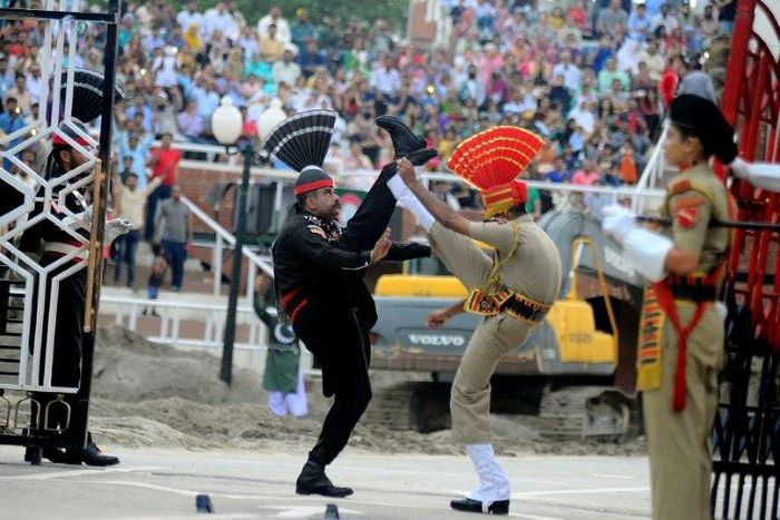 Indian and Pakistani border guards take part in the ceremony at the India-Pakistan border in Wagah
