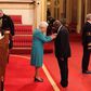 Chukwuemeka Chikezie getting his MBE from Queen Elizabeth
