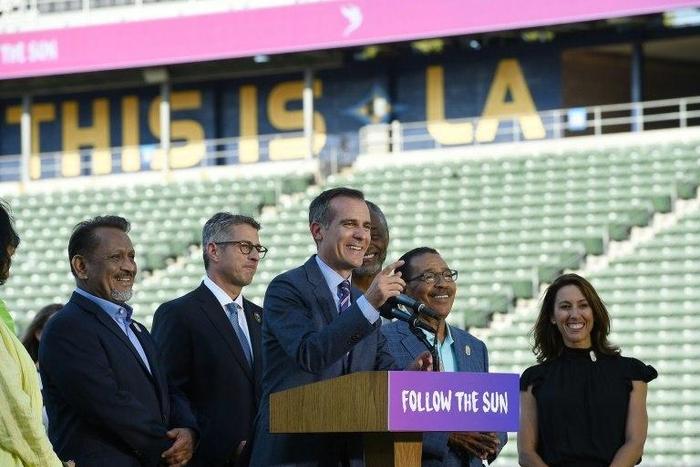 Los Angeles Mayor Eric Garcetti speaks at the podium to announce a deal with the International Olympic Committee to host the 2028 Summer Olympics, during a news conference at StubHub Center in Carson, California, on July 3, 2017