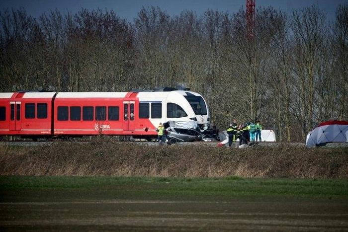 Emergency personnel work at the scene of a train crash on March 27, 2017 near Harlingen, northern Netherlands