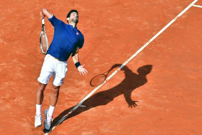 Novak Djokovic of Serbia serves to Roberto Bautista during their third round match at the ATP Tennis Open tournament on May 18, 2017 at the Foro Italico in Rome, Italy
