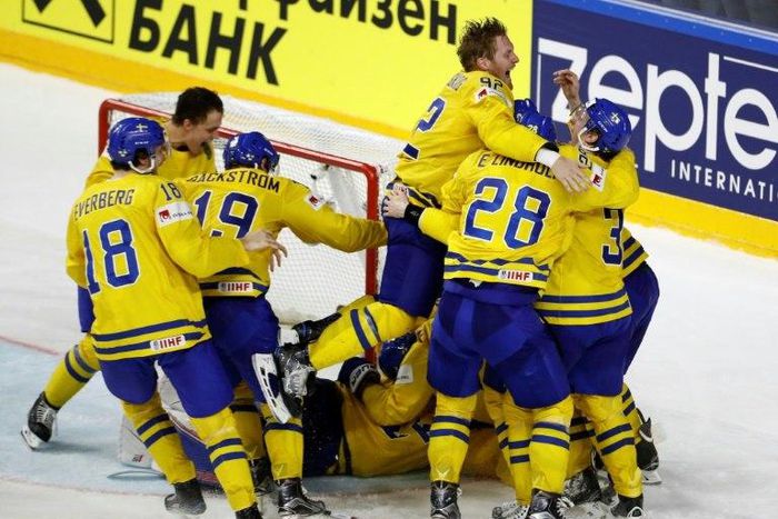 Sweden's players celebrate after winning the penalty shoot-out of the IIHF Men's World Championship Ice Hockey final match on May 21, 2017