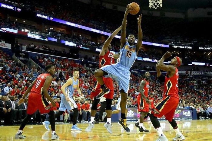 Malik Beasley of the Denver Nuggets shoots over Terrence Jones of the New Orleans Pelicans at the Smoothie King Center in New Orleans, Louisiana